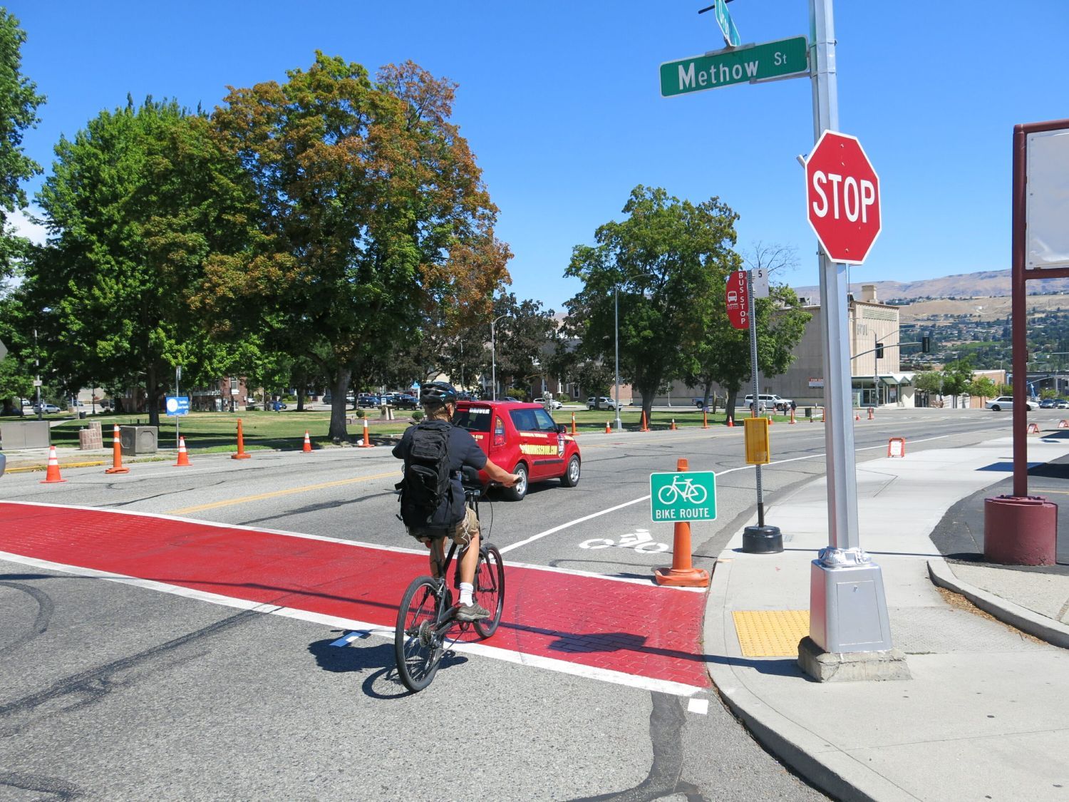 Cyclist crosses Methow intersection in Wenatchee, WA